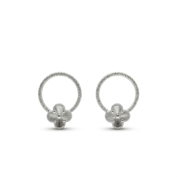Aretes flor halo de plata 925 con aro circular texturizado