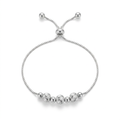Pulsera Plata 925 que combina pequeñas esferas lisas con tres piezas centrales texturizadas